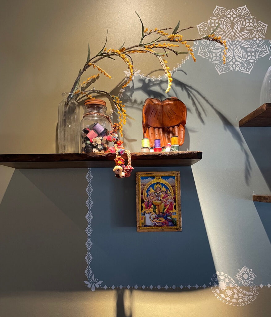 Indian decor using festive feel with hand stenciling in bright color - Avatar’s interiors designed by Carolyn Robbins