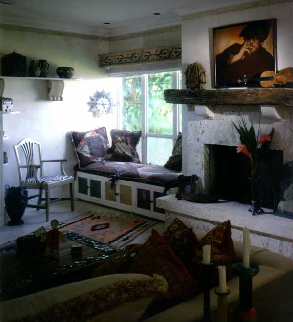 Natural enhancements using coral stone, mosaic and reuse wood cabinets and furnishings designed by Carolyn Robbins