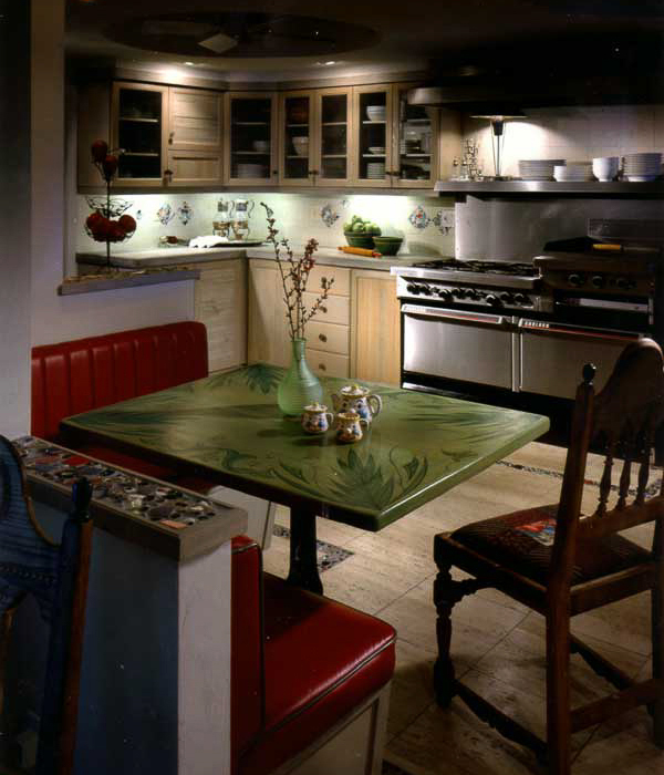 Natural enhancements using coral stone, mosaic and reuse wood cabinets and furnishings designed by Carolyn Robbins