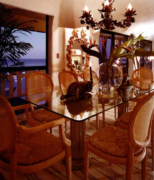 urton Goldberg’s penthouse interior in plaster arched ceilings and cave like alcoves, illuminates his primitive art collection interior design by Carolyn Robbins