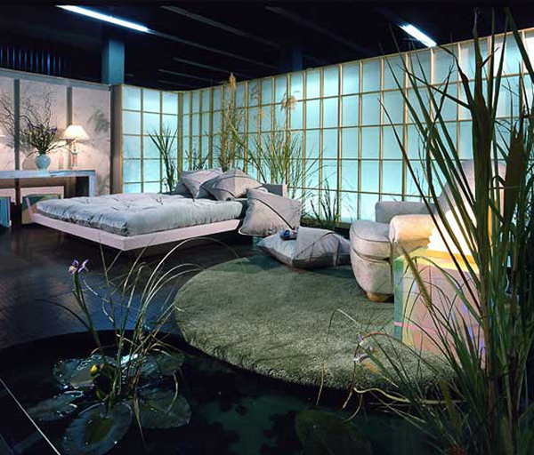 Soft pastels and sage greens in rubber tile and soft carpet surround a lily pond stream under a platform bed. Lily Pond designed by Carolyn Robbins