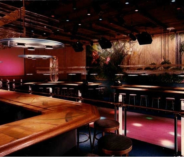 80’s dance club with lit lucite, jungle wall murals and aurora bar lighting - Banana Max nigtht Club interior designed by Carolyn Robbins
