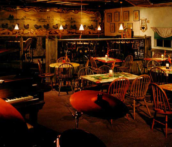 Rollick's carnival restaurant-bar with table top kinetic displays, hand-painted vintage circus posters for live jazz lovers. Classic carnival restaurant style with festive surprising animated art designed by Carolyn Robbins Interiors