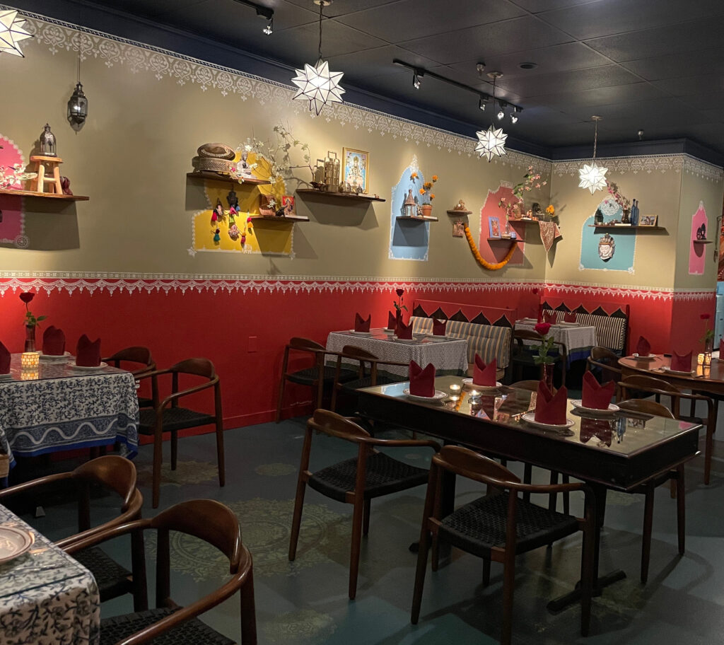 Indian decor using festive feel with hand stenciling in bright color - Avatar’s interiors designed by Carolyn Robbins