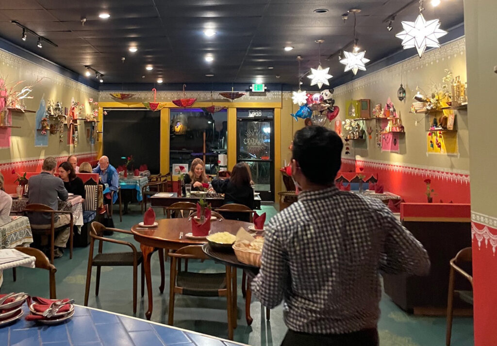 Indian decor using festive feel with hand stenciling in bright color - Avatar’s interiors designed by Carolyn Robbins