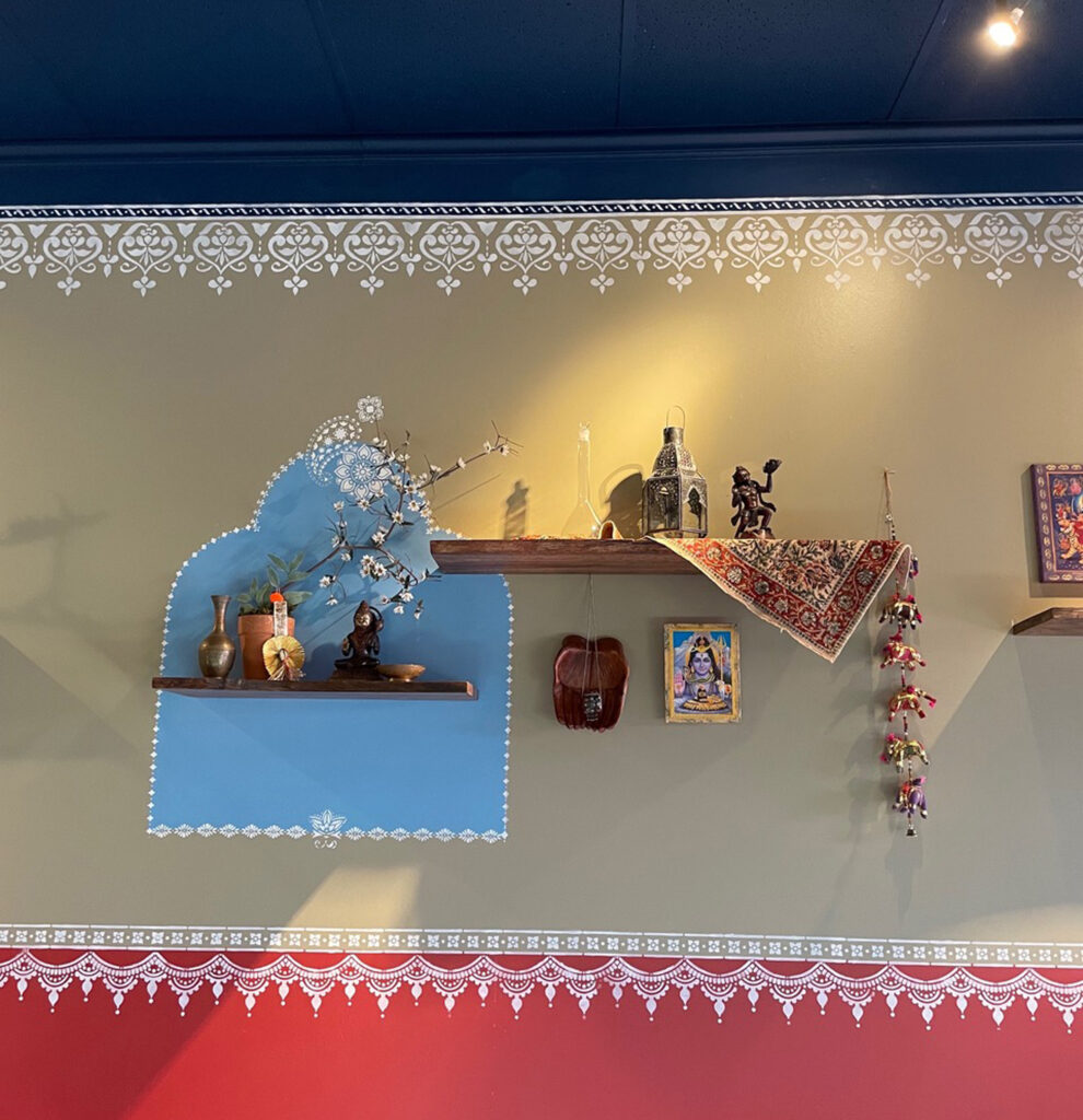 Indian decor using festive feel with hand stenciling in bright color - Avatar’s interiors designed by Carolyn Robbins