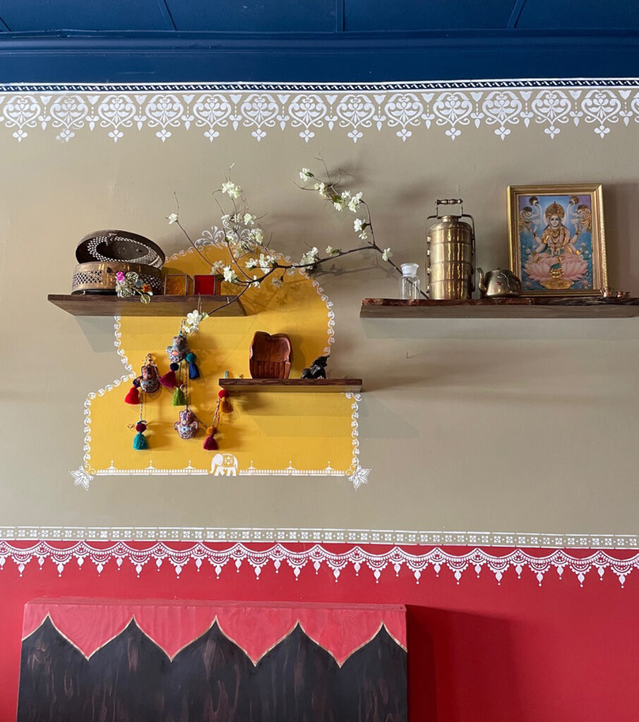 Indian decor using festive feel with hand stenciling in bright color - Avatar’s interiors designed by Carolyn Robbins