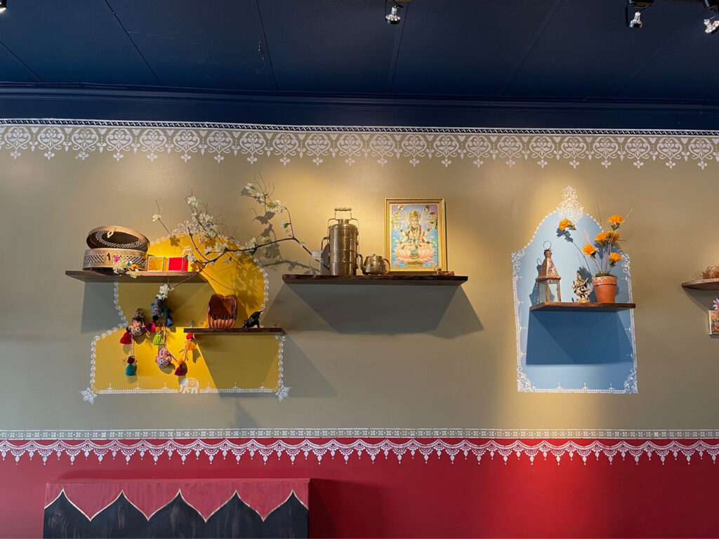 Indian decor using festive feel with hand stenciling in bright color - Avatar’s interiors designed by Carolyn Robbins