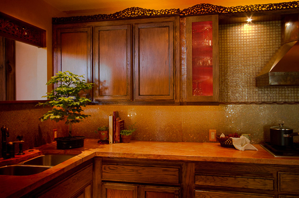 Warm kitchen details in copper tones and broken glass mosaic - Heeb Interior design by Carolyn Robbins