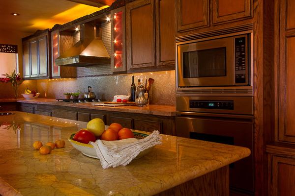 Warm kitchen details in copper tones and broken glass mosaic - Heeb Interior design by Carolyn Robbins