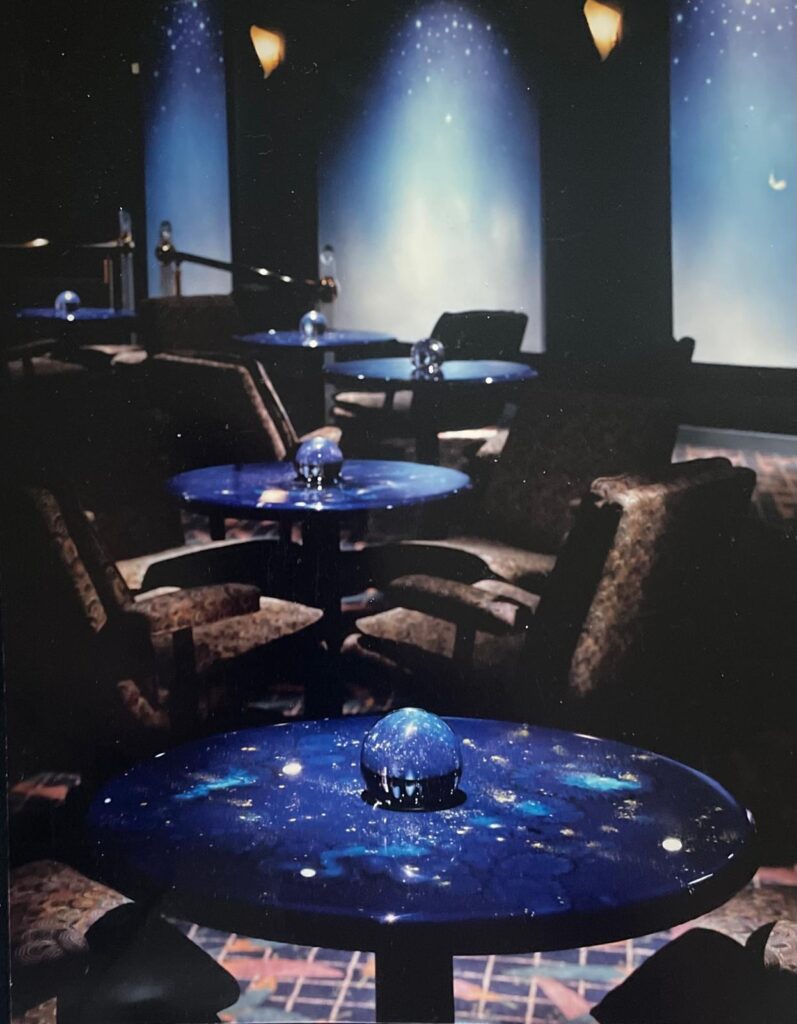 80’s dance club with lit lucite, jungle wall murals and aurora bar lighting - Banana Max nigtht Club interior designed by Carolyn Robbins