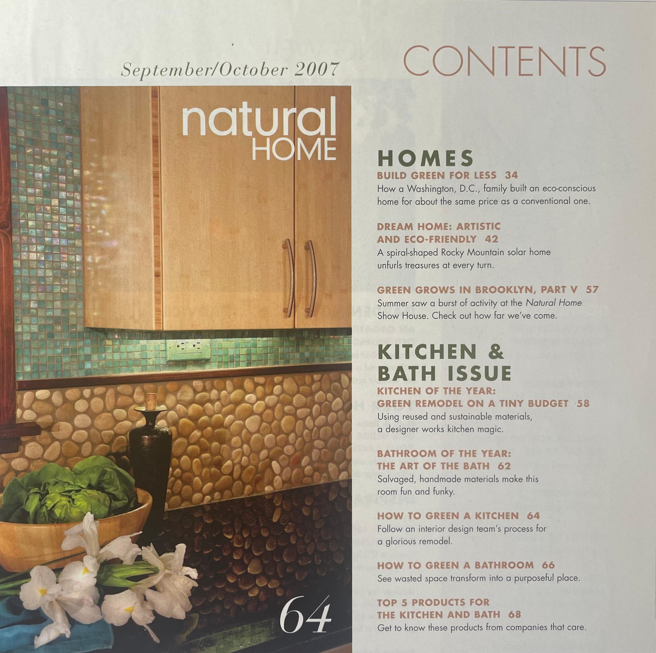 Noted kitchen interior blending sustainable bamboo, river rock, reflective dark granite and aqua glass tile for Japanese inspired seaside interior designed by Carolyn Robbins